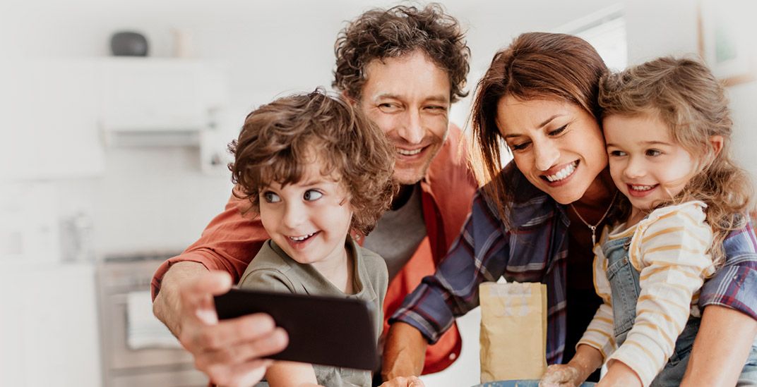 Family of four taking a selfie