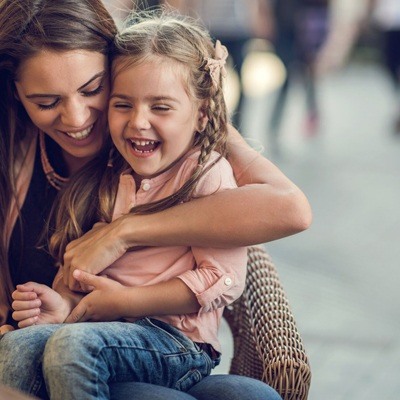 Mother smiling with daughter