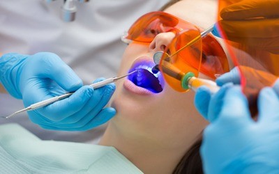 dentist giving a patient a filling