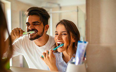 Couple brushing teeth 