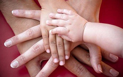 Family hands on top of each other