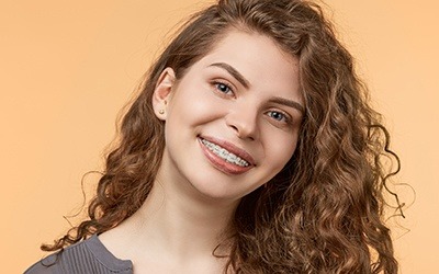 Teen girl with bracket and wire braces