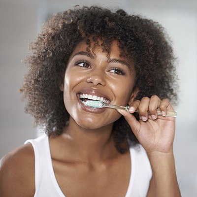 Woman brushing teeth