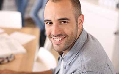 Smiling man at desk