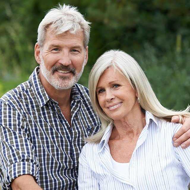 Senior couple with healthy attractive smiles