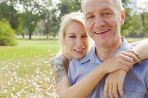 couple smiling in the park